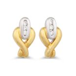 A PAIR OF DIAMOND SET EARRINGS, mounted in 18ct white and yellow gold, of cross over design, mounted