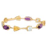 AN AMETHYST AND CITRINE BRACELET, mounted in 18ct yellow gold