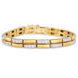 A DIAMOND SET PANEL BRACELET, the alternating diamond set links in 18ct yellow gold, 24.7 g.