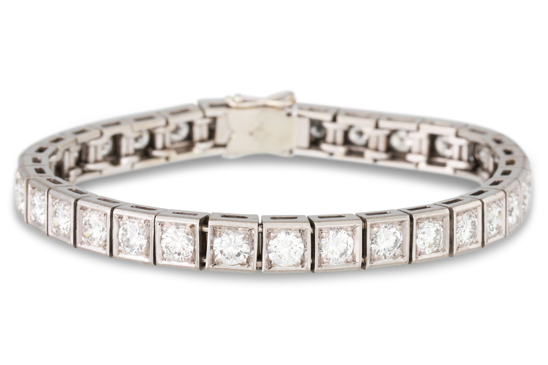 A DIAMOND LINE BRACELET, set with thirty-two round brilliant cut diamonds, mounted in white gold.