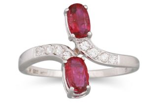A RUBY AND DIAMOND RING, of cross-over design, set with two oval rubies and diamond detail,