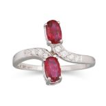 A RUBY AND DIAMOND RING, of cross-over design, set with two oval rubies and diamond detail,