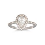 A DIAMOND HALO CLUSTER RING, the pear shaped diamond, to diamond surround and shoulders, mounted