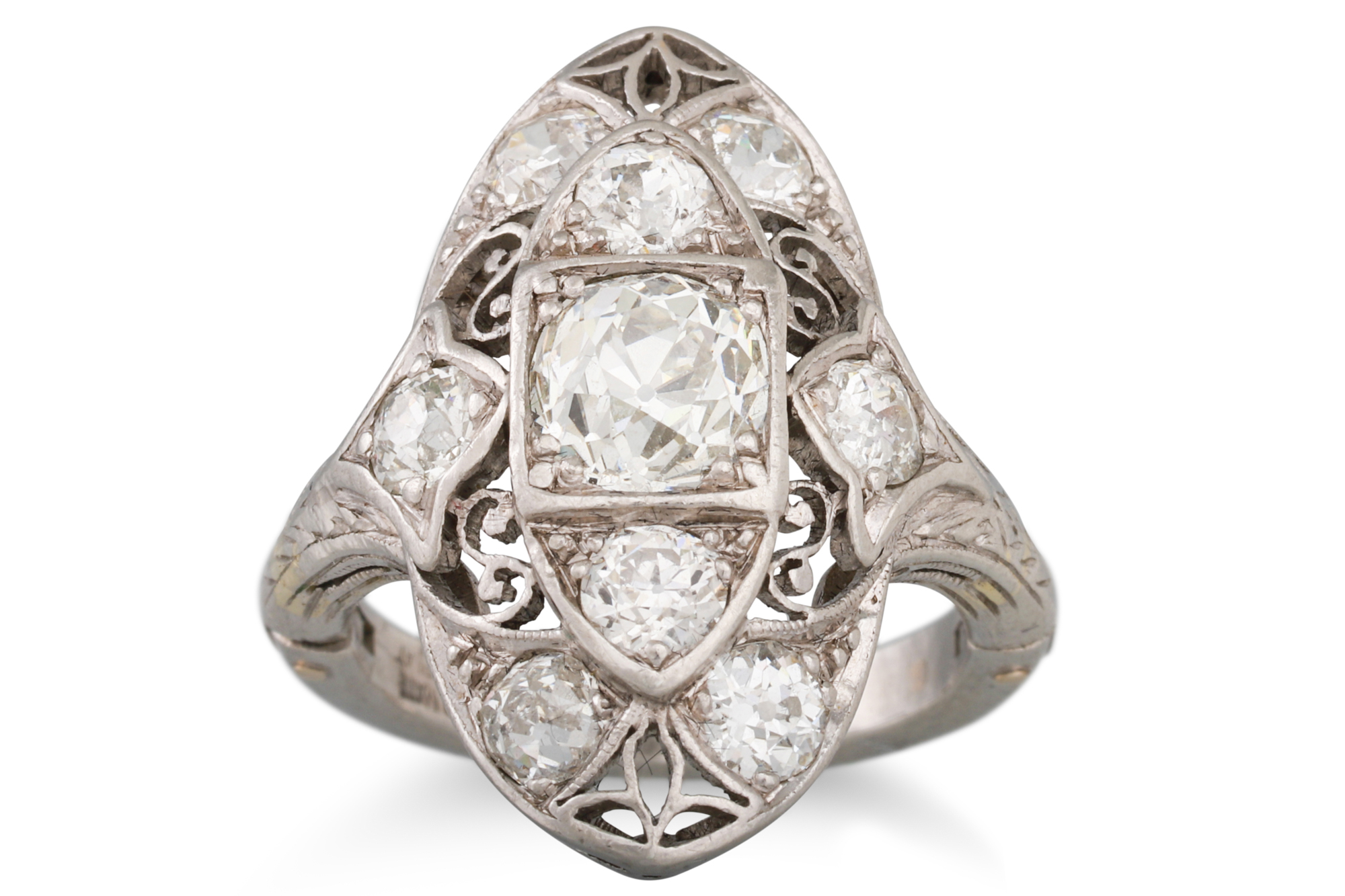 AN ART DECO BOAT SHAPED DIAMOND CLUSTER RING, the old cut diamonds mounted in platinum,