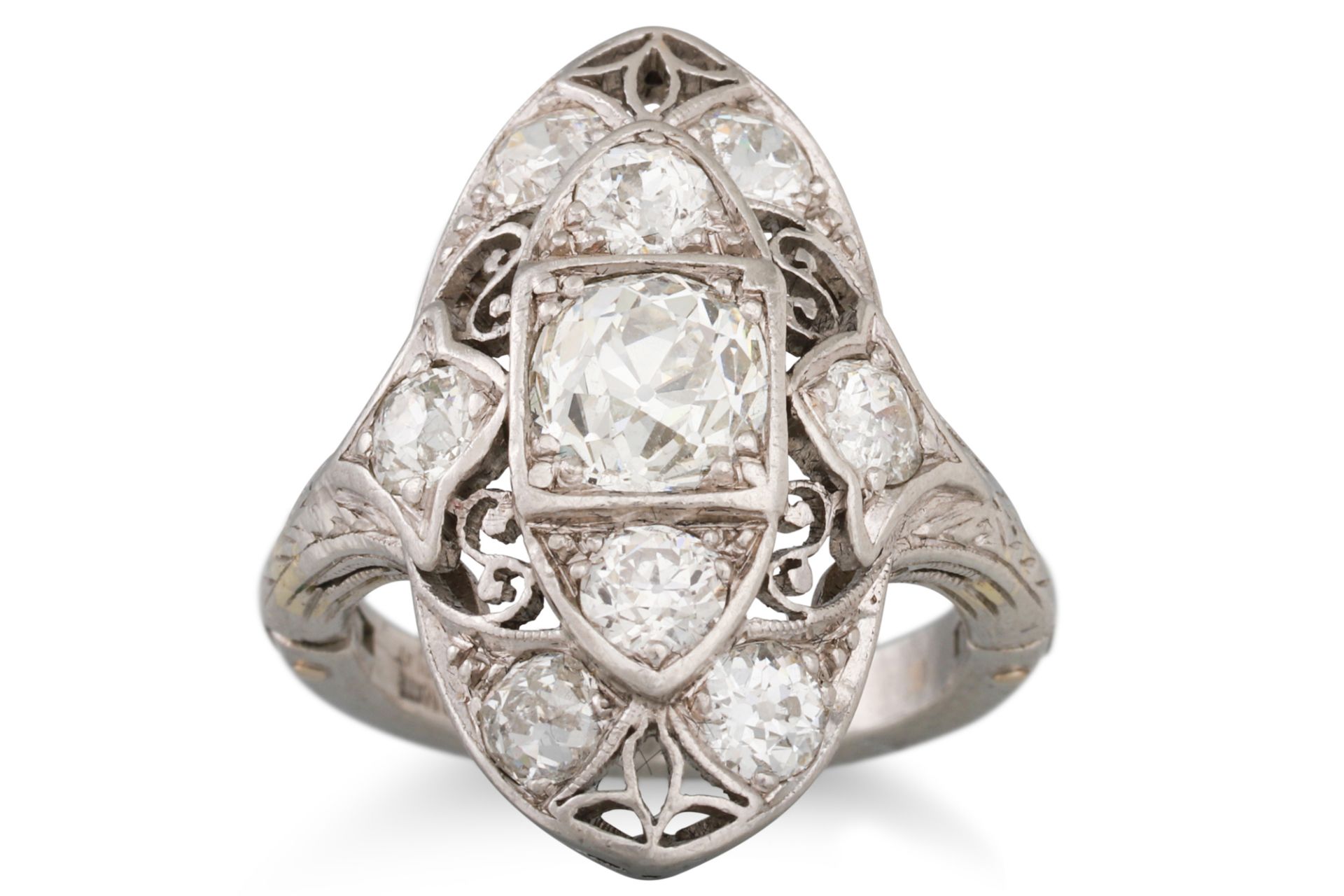 AN ART DECO BOAT SHAPED DIAMOND CLUSTER RING, the old cut diamonds mounted in platinum,