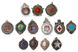 A COLLECTION OF THIRTEEN PRE 1950S FOOTBALL MEDALS, mostly silver