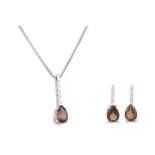 A DIAMOND AND SMOKY QUARTZ PENDANT, mounted in white gold, together with matching earrings