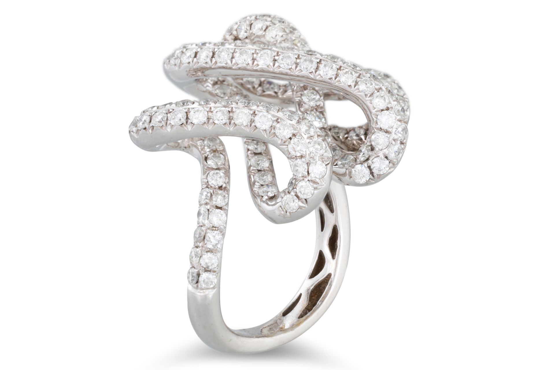 AN UNUSUAL PAVE SET DIAMOND RING, twisted figure of eight form, mounted in 18ct white gold, size M