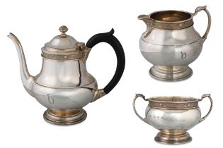 A MODERN IRISH THREE PIECE CELTIC REVIVAL TEA SERVICE, Dublin 1980, by Alwright & Marshall, 1135 g.