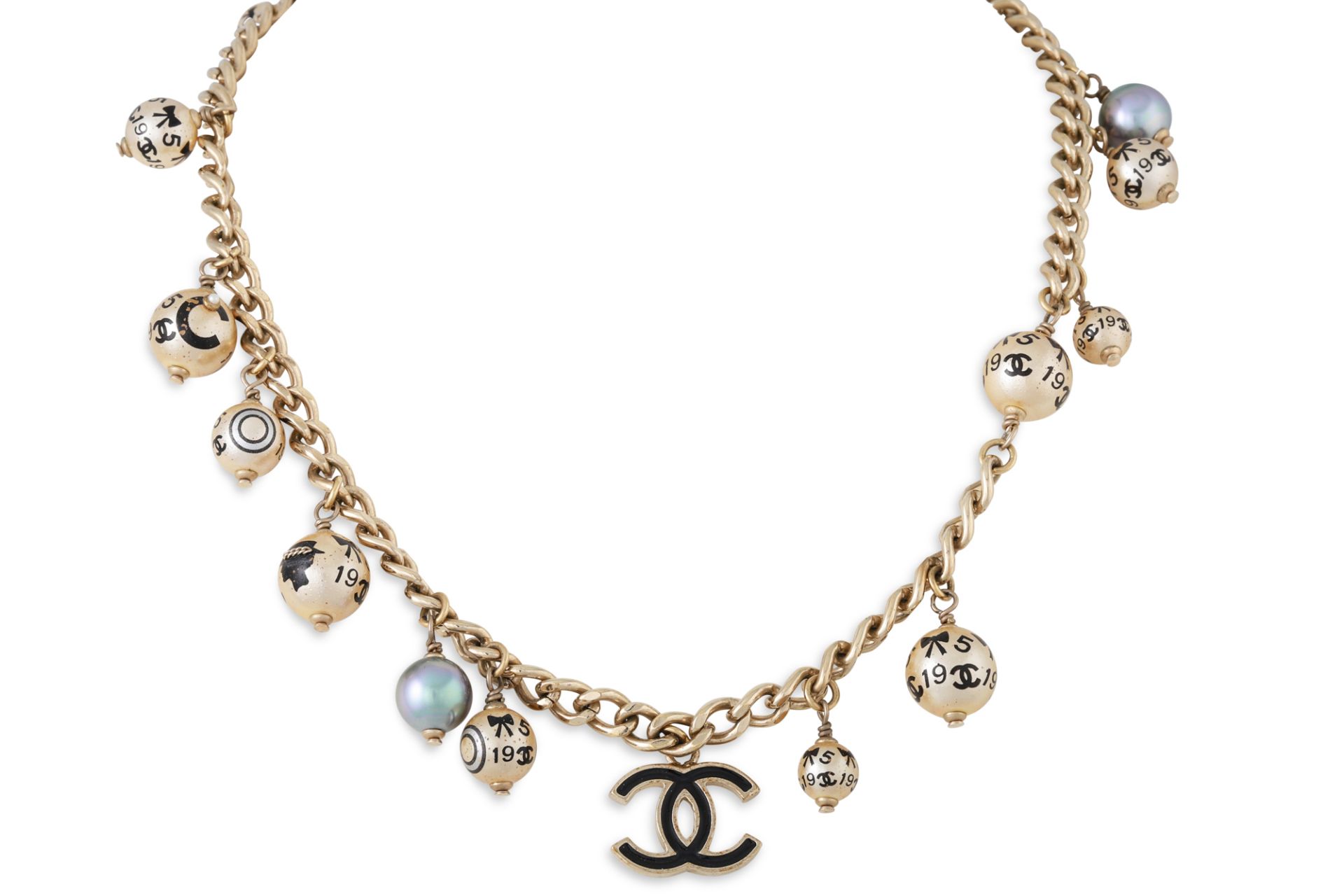 A CHANEL BEADED CHARM NECKLACE, the curb link chain suspending faux pearl and a double C charms,