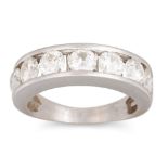 A DIAMOND SEVEN STONE RING, the brilliant cut diamonds channel set in 18ct white gold. Estimated: