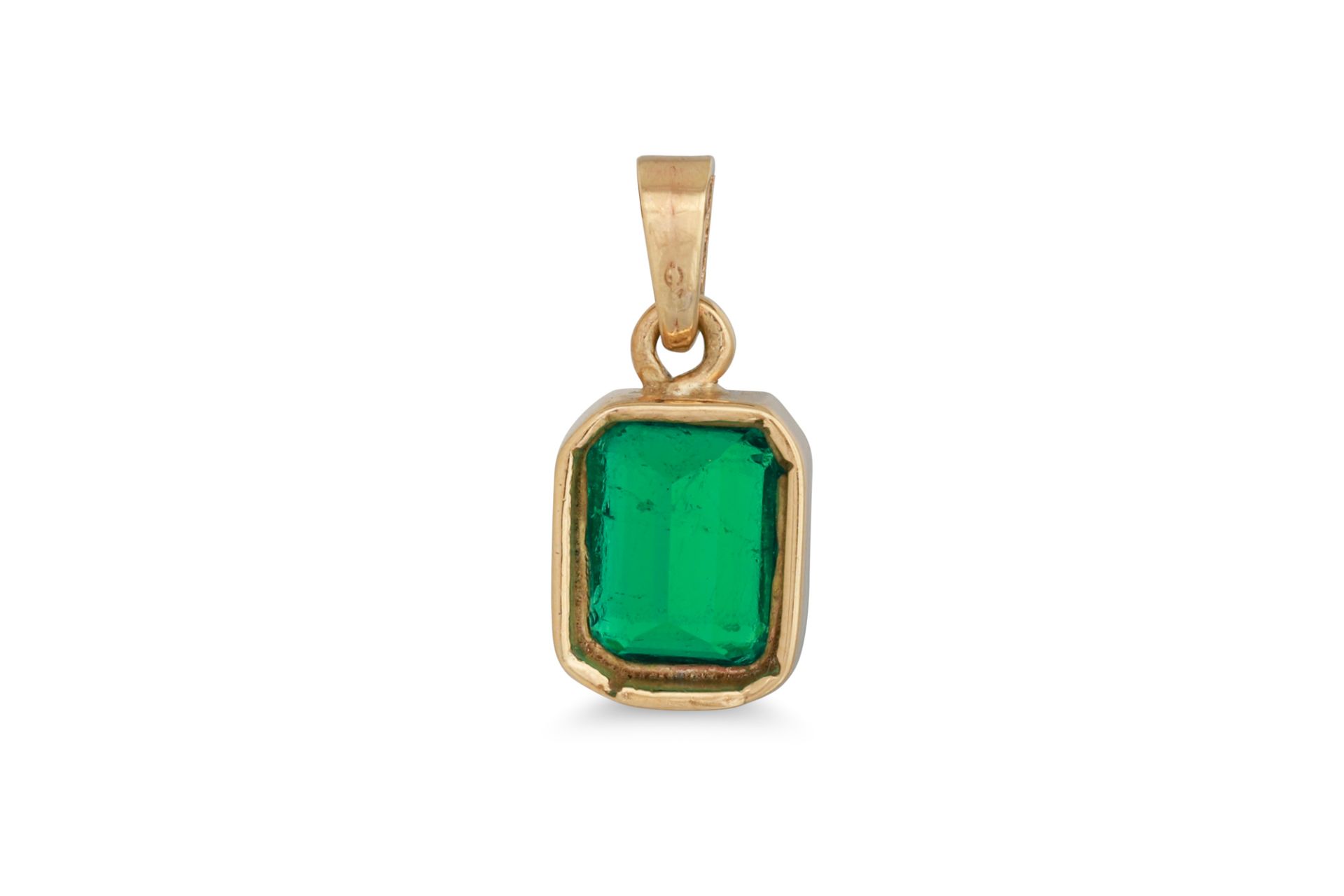 AN EMERALD PENDANT, the rectangular emerald mounted in yellow gold. Estimated: weight of emerald: