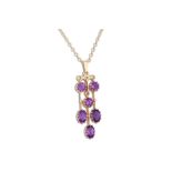 AN AMETHYST DROP PENDANT, the six stone amethyst of drop design mounted in yellow gold on a 9ct gold