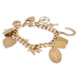 A 9CT GOLD CURB LINK BRACELET, with 9 charms, 47 g.