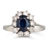 A SAPPHIRE AND DIAMOND CLUSTER DRESS RING, mounted in 18ct white gold, size M - N