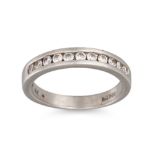 A DIAMOND SET BAND RING, the eleven brilliant cut diamonds channel set in platinum, size J