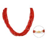 A MULTI-STRANDED BEADED CORAL NECKLACE, to a 18ct gold barrel clasp