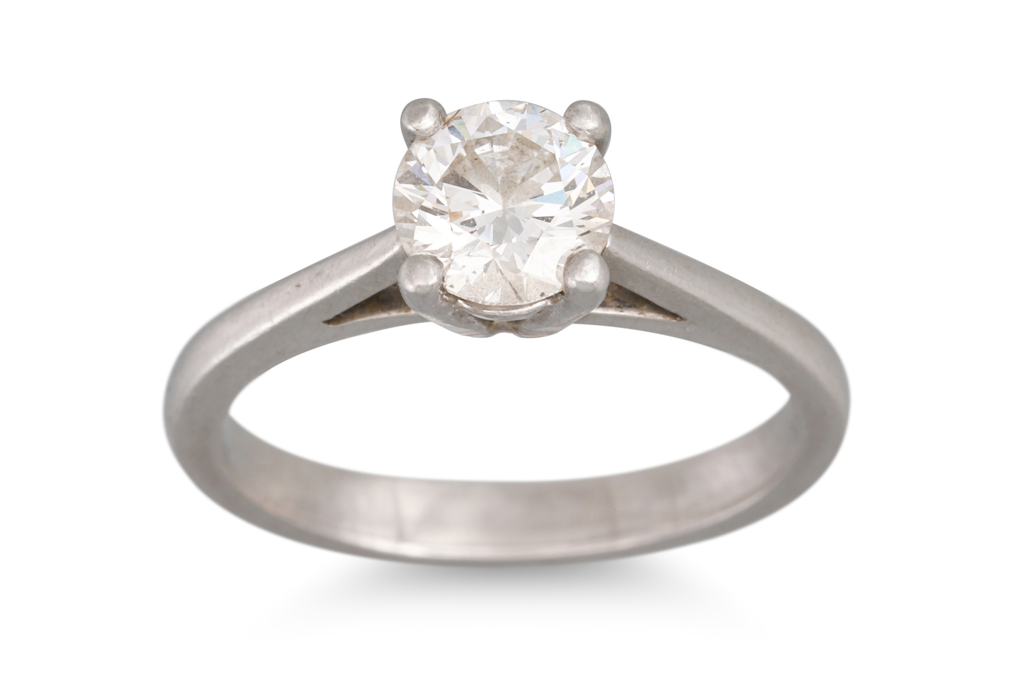 A DIAMOND SOLITAIRE RING, the round brilliant cut diamond mounted in platinum, stamped .950.