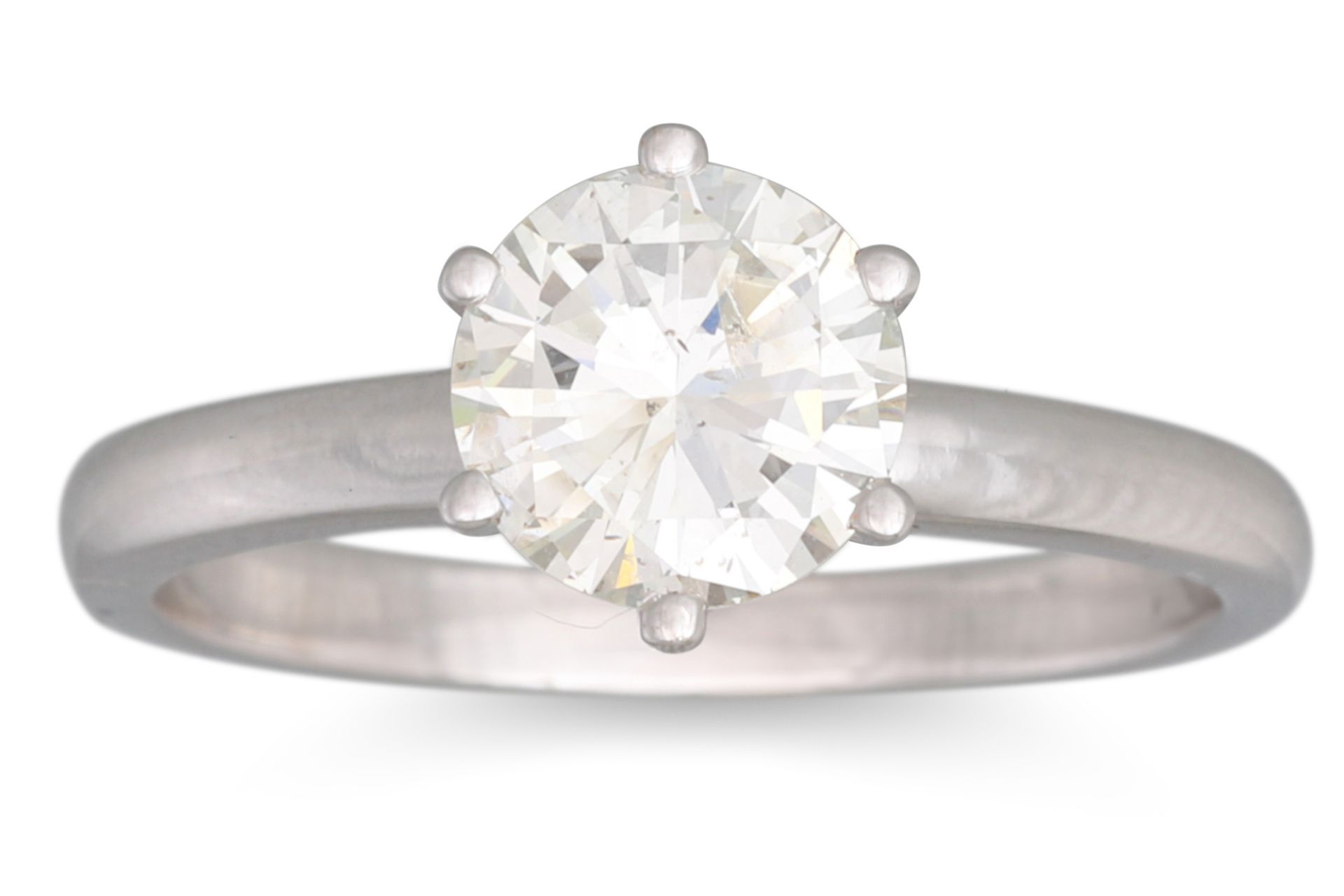 A DIAMOND SOLITAIRE RING, the brilliant cut diamond mounted in white gold. Estimated: weight of