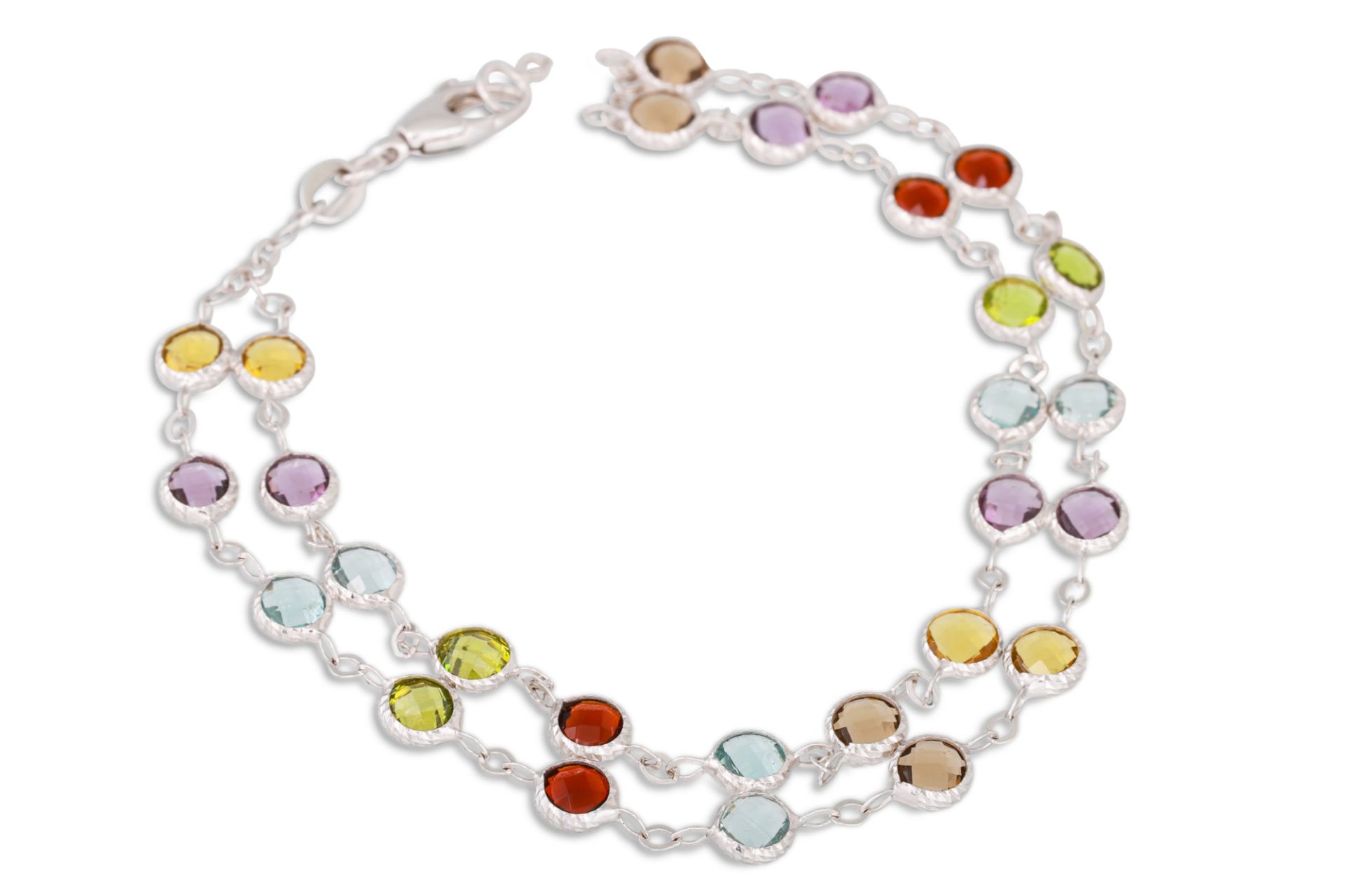 A TWO ROWED MULTI GEM - SET BRACELET, the various gems colet set, to 18ct white gold chain links