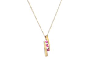A RUBY AND DIAMOND PENDANT, mounted in 9ct yellow gold, on a chain