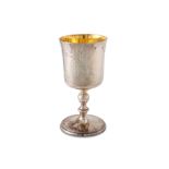 A LATE 20TH CENTURY IRISH SILVER GILT CHALICE/GOBLET, with engraved decoration, raised over a