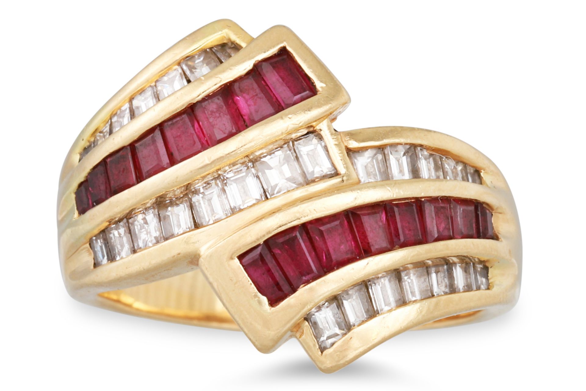 A DIAMOND AND RUBY CLUSTER RING, the baguette cut diamond and rubies, mounted in 14ct yellow gold,