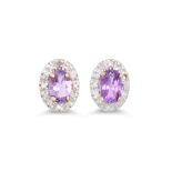 A PAIR OF DIAMOND AND AMETHYST CLUSTER EARRINGS, the oval amethyst to diamond surround, mounted in