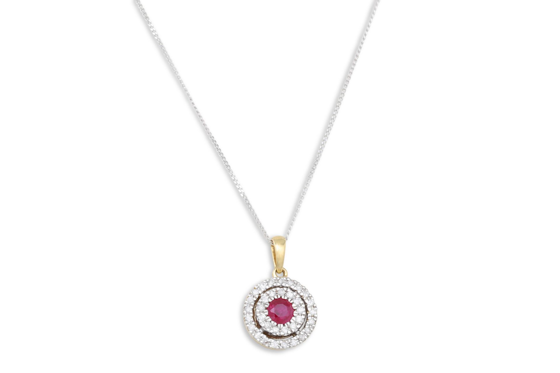A DIAMOND AND RUBY TARGET PENDANT, the ruby to a two rowed diamond surround, mounted in 9ct white