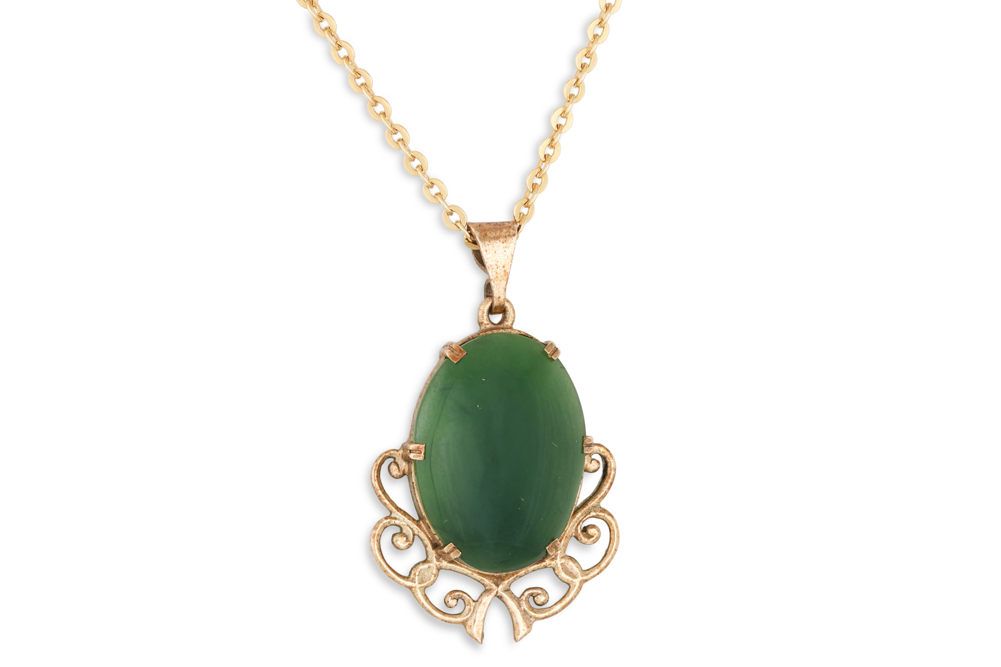 A JADE PENDANT, mounted in 9ct gold, on a 18ct gold chain, 4.4 g.