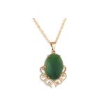 A JADE PENDANT, mounted in 9ct gold, on a 18ct gold chain, 4.4 g.