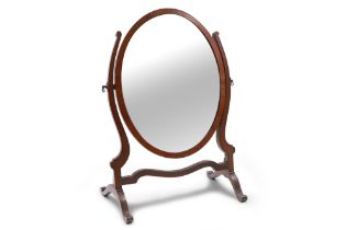 AN ANTIQUE OVAL MAHOGANY CRUTCH FRAME DRESSING TABLE MIRROR, circa 24" tall