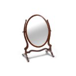 AN ANTIQUE OVAL MAHOGANY CRUTCH FRAME DRESSING TABLE MIRROR, circa 24" tall