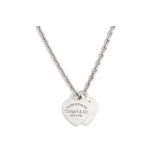 A SILVER TIFFANY PENDANT, stamped 'I Love you, Tiffany & Co.' on a silver chain