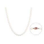 A CULTURED PEARL NECKLACE, cream tones, the 9ct yellow gold clasp set with seed pearls and an