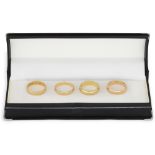 FOUR 18CT YELLOW GOLD BAND RINGS, 16.1 g. Size: L x 3, N