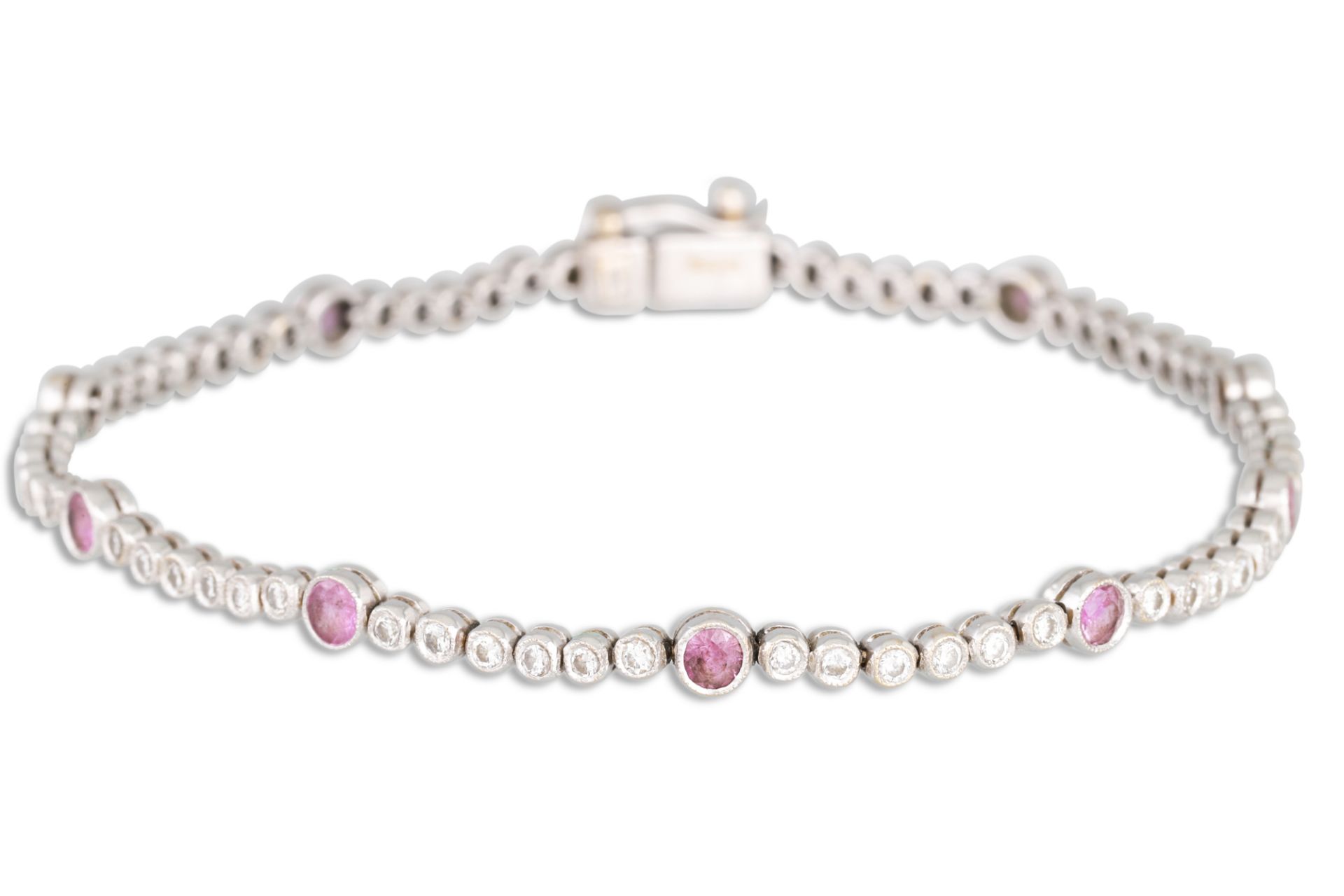 A PINK SAPPHIRE AND DIAMOND LINE BRACELET, mounted in 18ct white gold. Estimated: weight of