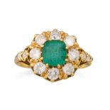 AN ANTIQUE EMERALD AND DIAMOND CLUSTER RING, to diamond set shoulders, mounted in 18ct yellow