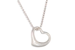 A SILVER TIFFANY HEART PENDANT, by Elsa Peretti, on a silver chain