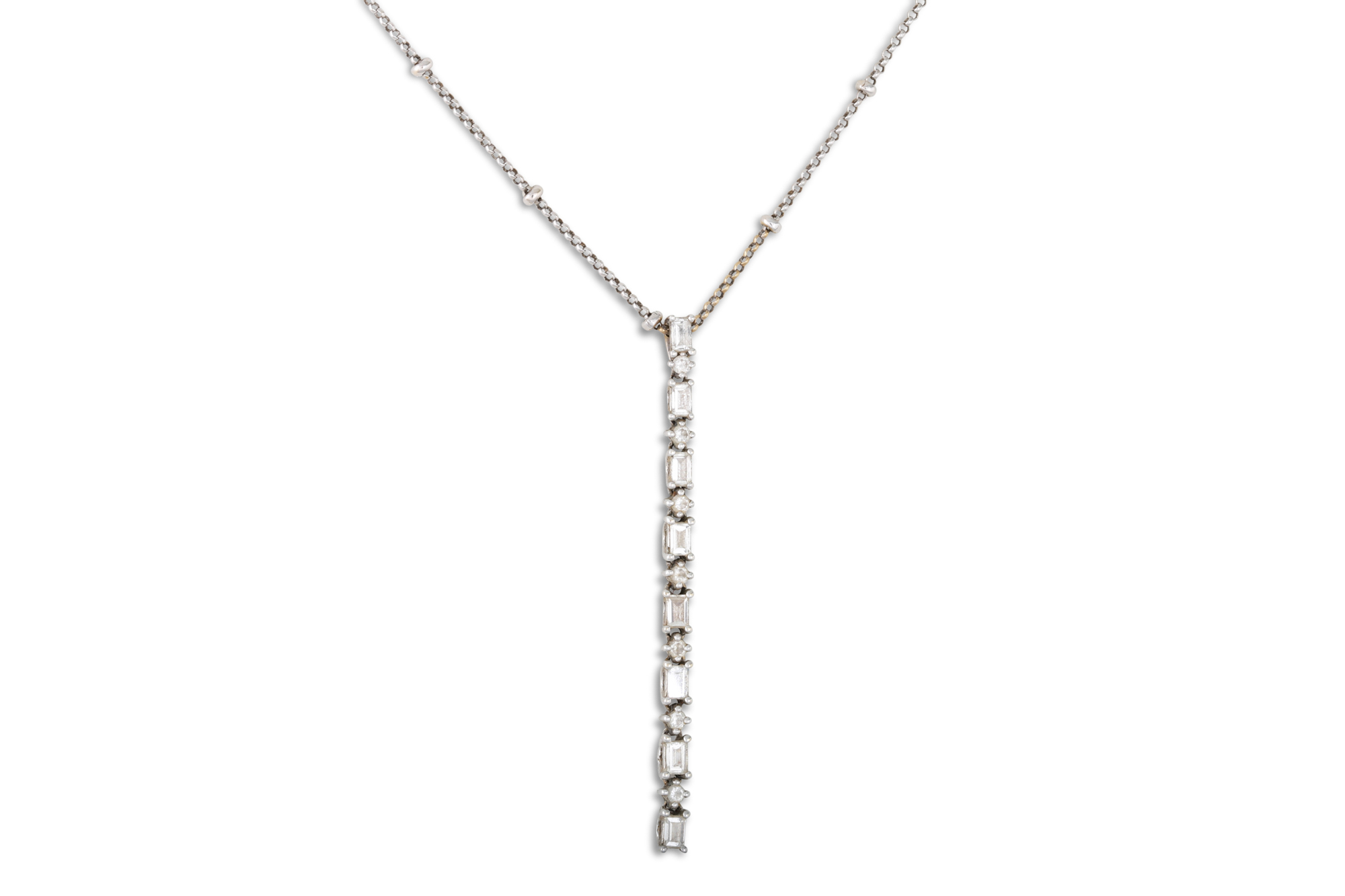 A DIAMOND SET PENDANT, set with a line of eight emerald cut diamonds interspersed with seven