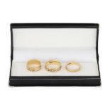 THREE 10CT GOLD CELTIC BAND RINGS, 13.7 g. Size: P x 2, N