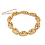 AN ART NOUVEAU PEARL AND GOLD BRACELET, each abstract oval panel set with a pearl, in 18ct gold,