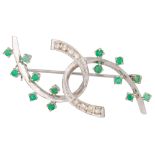 A DIAMOND AND EMERALD BROOCH, intertwined abstract form, mounted in 18ct white gold