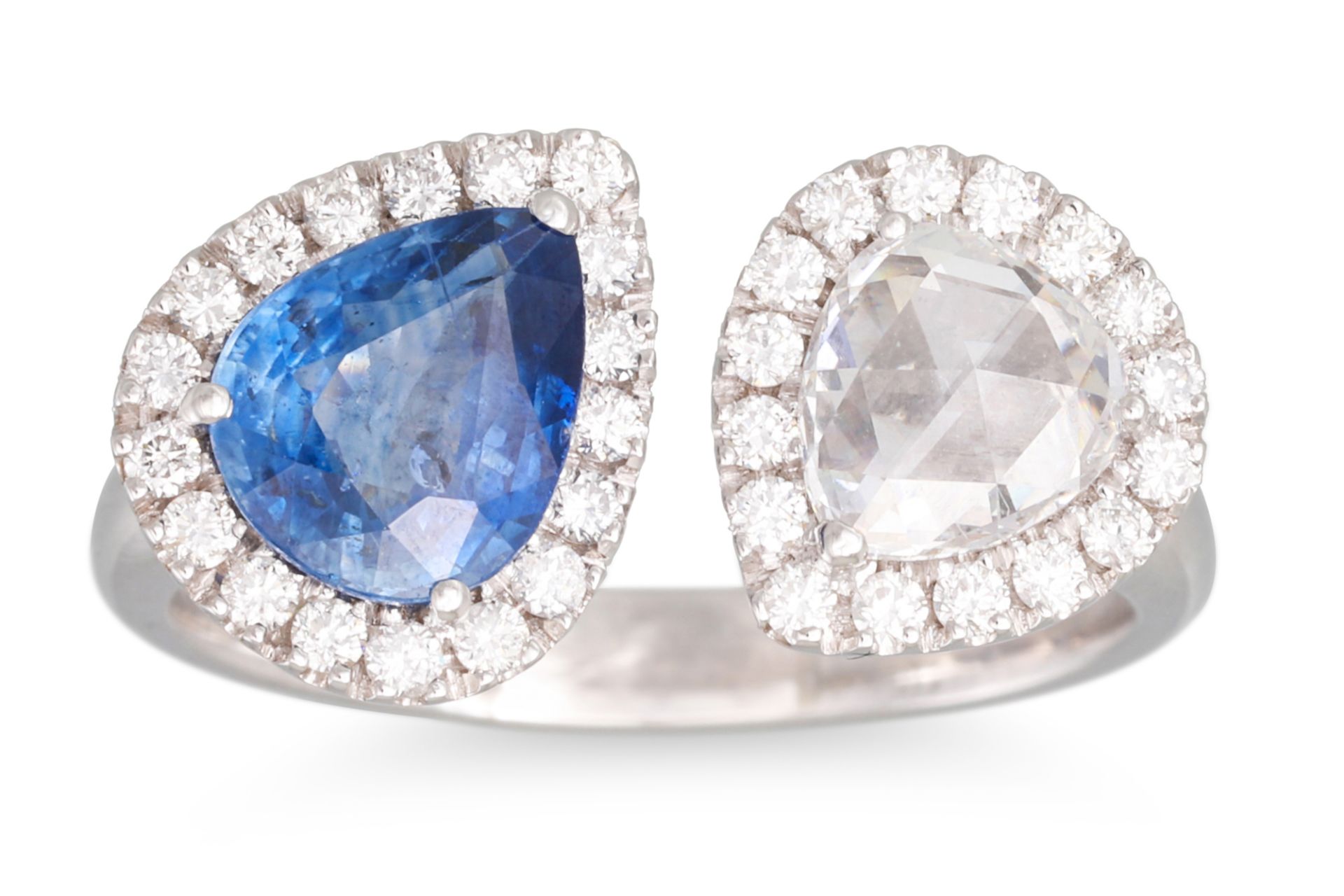 A TOI ET MOI DIAMOND AND SAPPHIRE CROSS-OVER CLUSTER RING, the pear shaped sapphire and rose cut