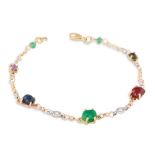 A RUBY, EMERALD AND SAPPHIRE CABOCHON SET BRACELET, the diamond spacers in 18ct yellow gold