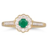 A DIAMOND AND EMERALD TARGET STYLE RING, the round emerald to diamond surround and shoulders,