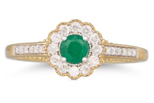 A DIAMOND AND EMERALD TARGET STYLE RING, the round emerald to diamond surround and shoulders,