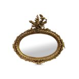 AN IMPRESSIVE 19TH CENTURY EMPIRE STYLE MIRROR, gilt & gesso oval shape, surmounted by Neo Classical