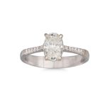 A DIAMOND SOLITAIRE RING, the oval brilliant cut diamond mounted in 18ct white gold to diamond