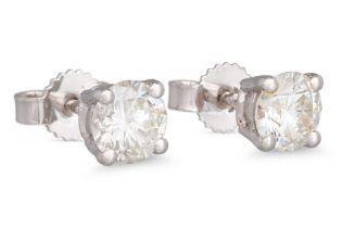 A PAIR OF DIAMOND STUD EARRINGS, the brilliant cut diamonds mounted in 18ct white gold. Together